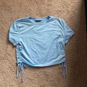 blue crop top with singed sides